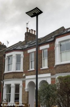 smoking cigarettes: one of several new LED streetlights that have been put in on residential roads all over Hounslow council part of Chiswick, London