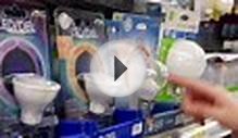 clip 60695915: Woman buying led daylight bulb inside